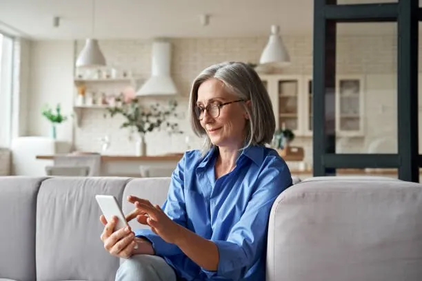 An adult using technology to support everyday communication