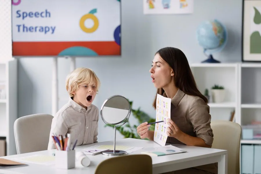 A speech-language pathologist working with a child