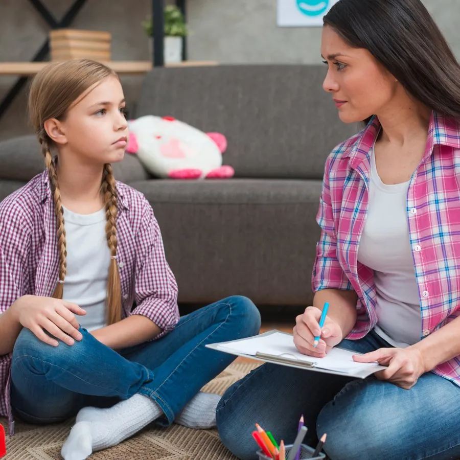 A teen talking with a care professional