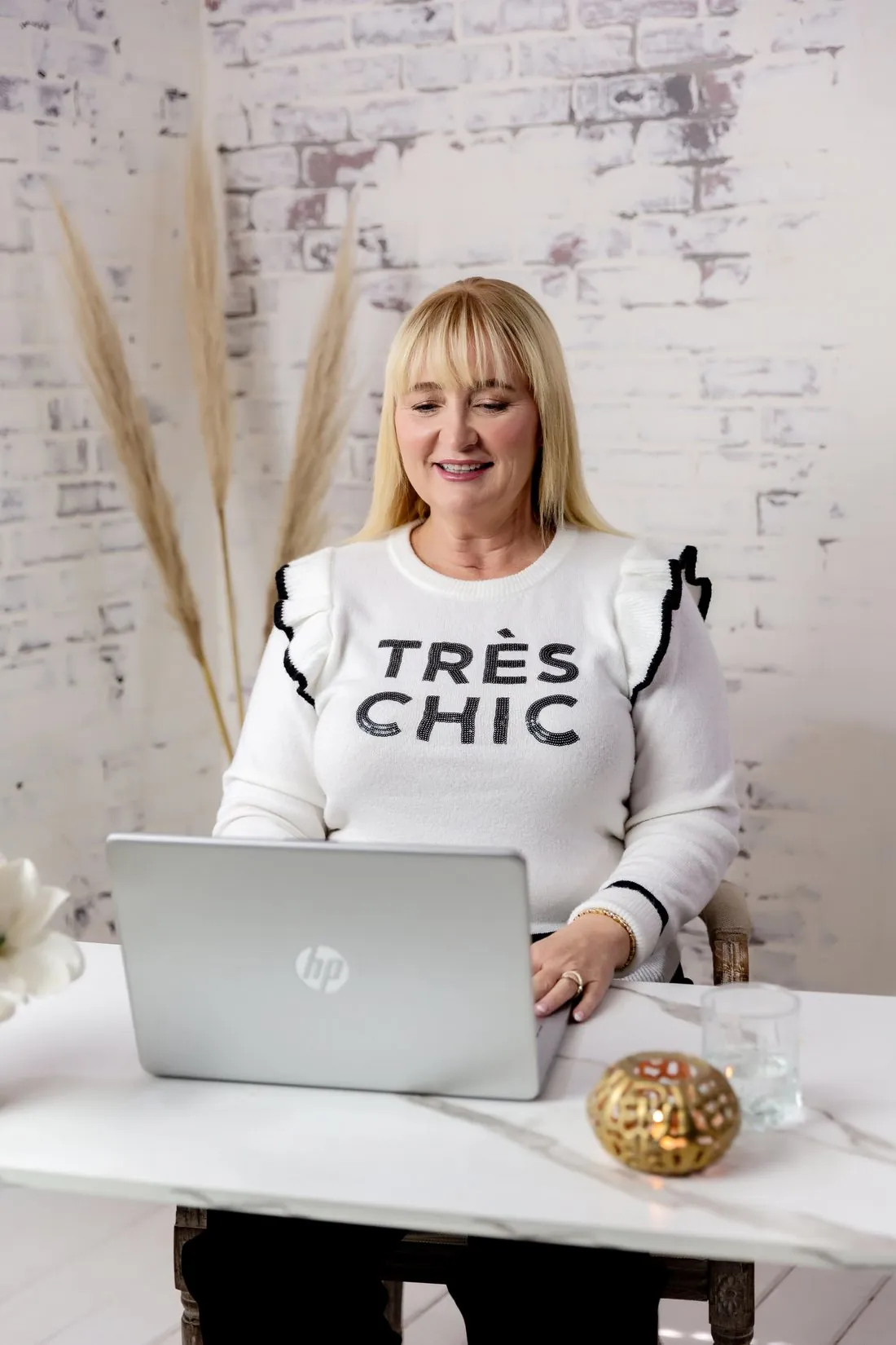 Siobhain McHale working at her laptop during an online session